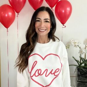 White Sweatshirt with Red Heart Design
